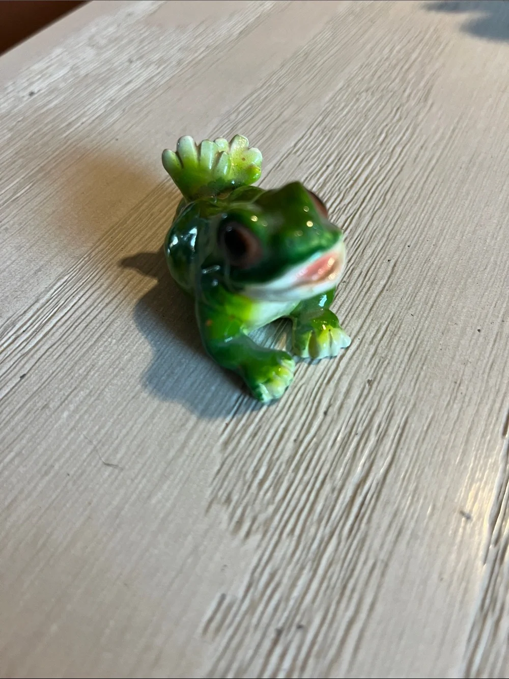 Ceramic green frog chilling